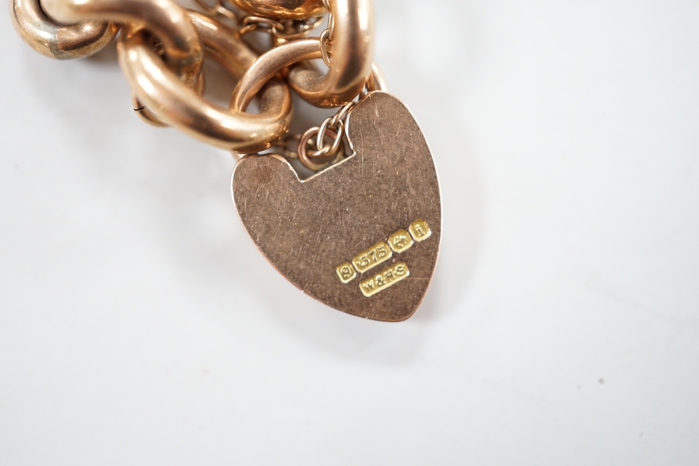 An Edwardian 9ct gold curb link bracelet, with heart shaped padlock clasp, 19cm, 16.2 grams.